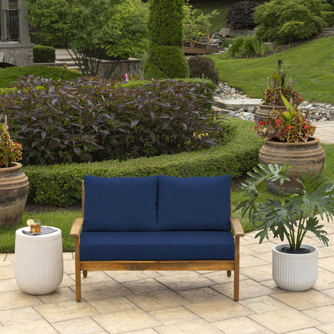 Arden Selections sapphire blue back pillow outdoor lounging side view