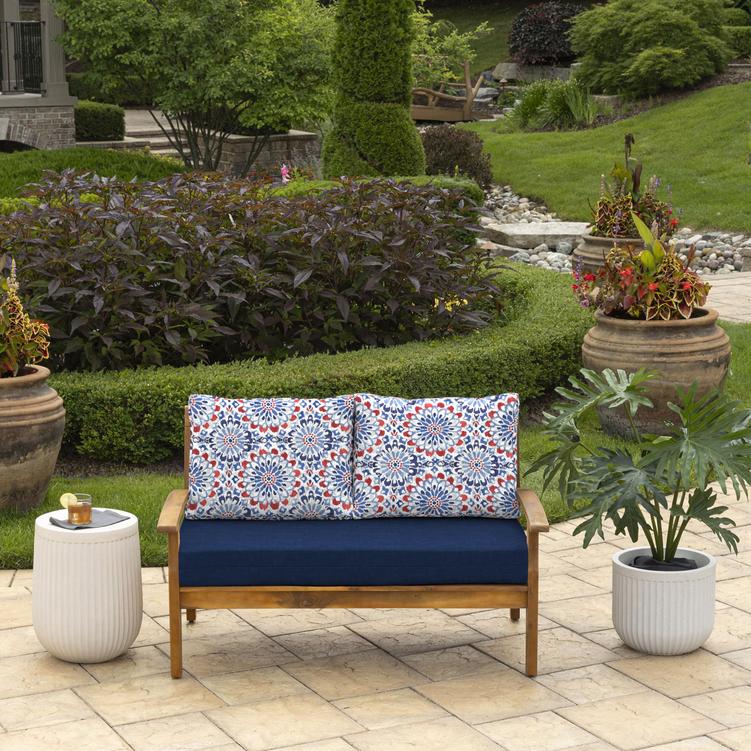 Arden Selections Clark Blue cushions on a loveseat, side view showing color stability.