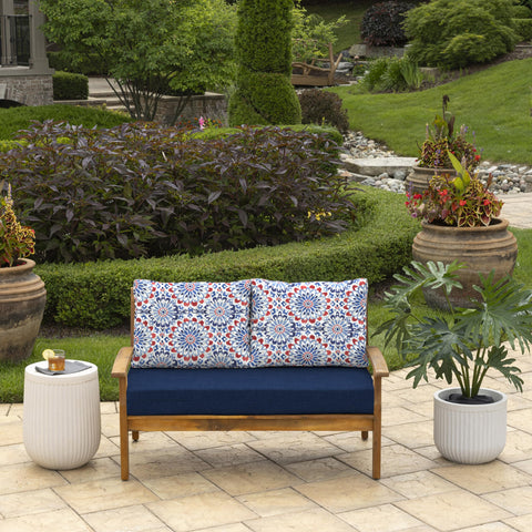 Arden Selections Clark Blue cushions on a loveseat, side view showing color stability.