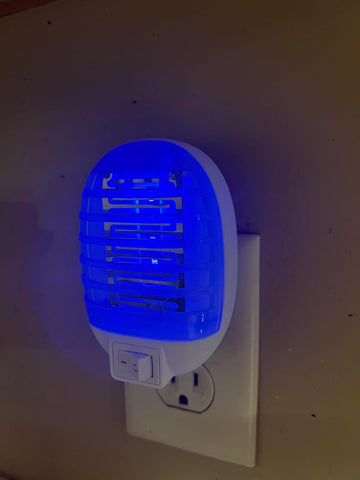 Ariie Bug Zapper Indoor in living room demonstrates quiet operation.