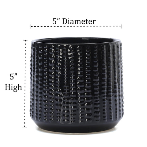 Arktiva textured round black planter adds modern style to any space