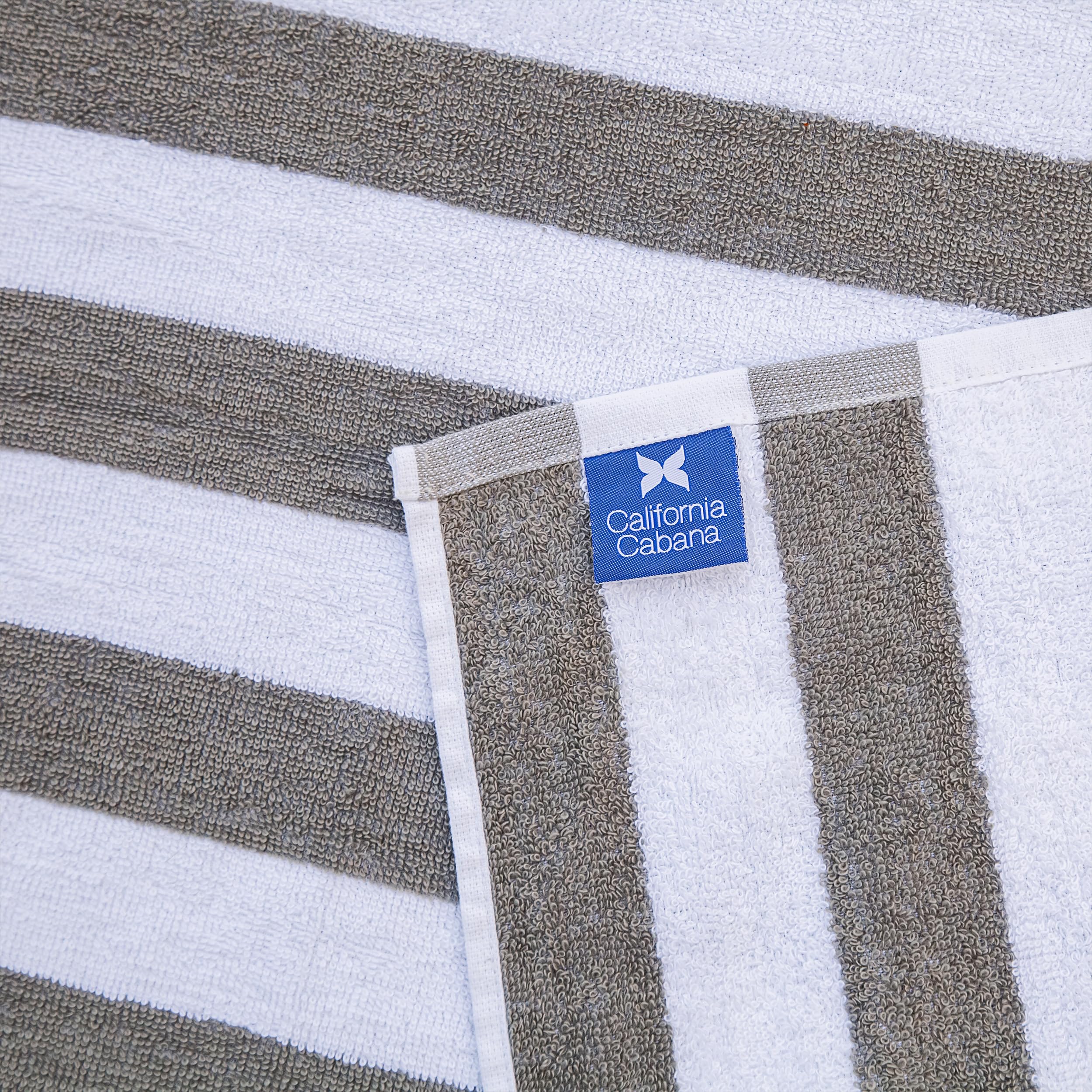 Arkwright California cabana towel tones match this lounge cover for cohesive poolside look.