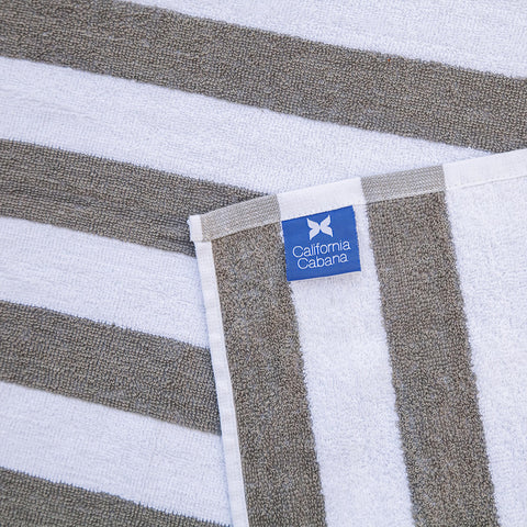 Arkwright California cabana towel tones match this lounge cover for cohesive poolside look.