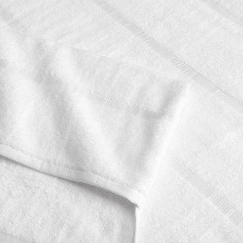 Arkwright Las Rayas absorbent lounge towel dries quickly after swimming.
