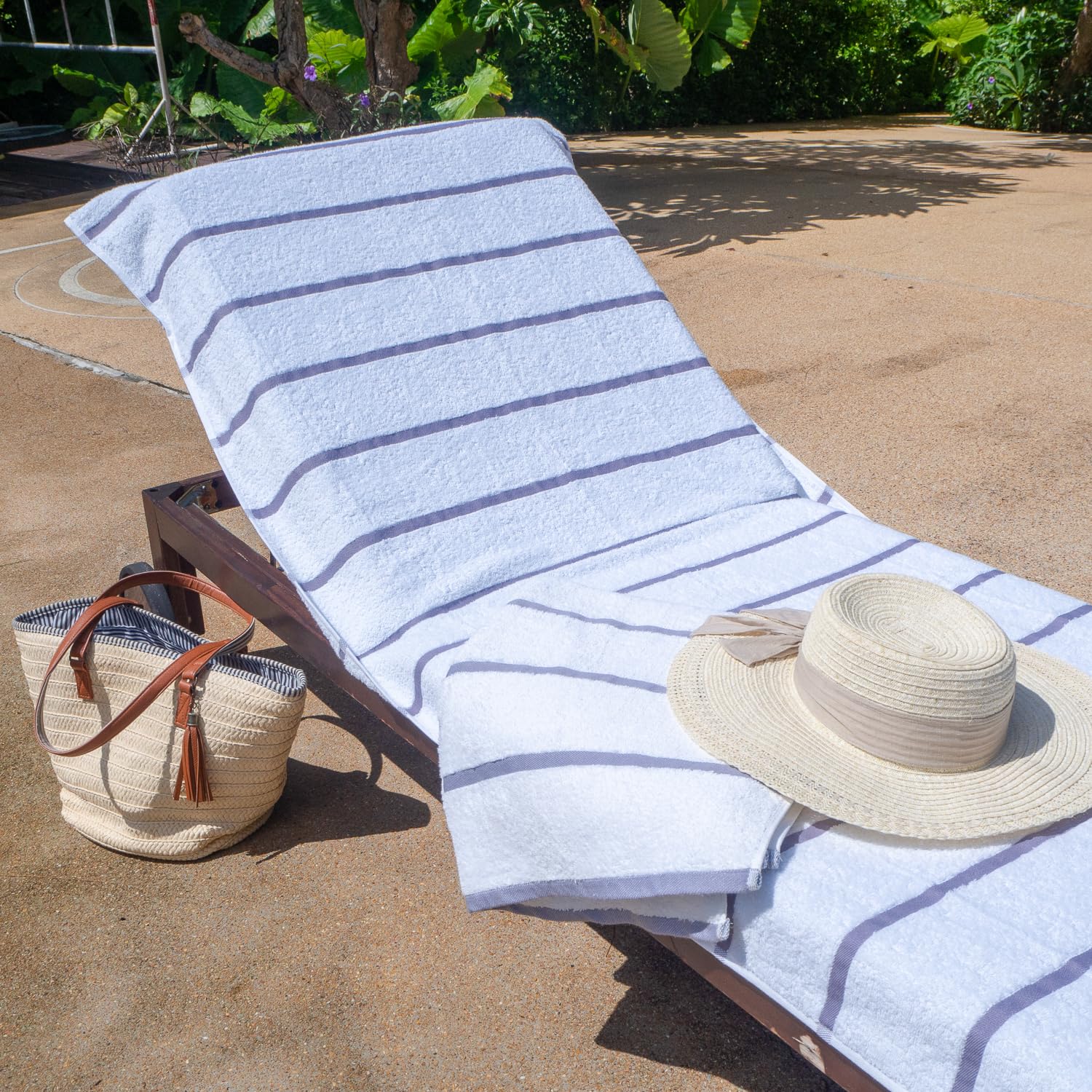Poolside lounge cover on outdoor chair with Arkwright Las Rayas design.