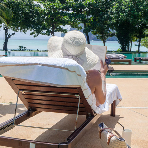 Arkwright Vibrant horizontal stripes brighten poolside seating.