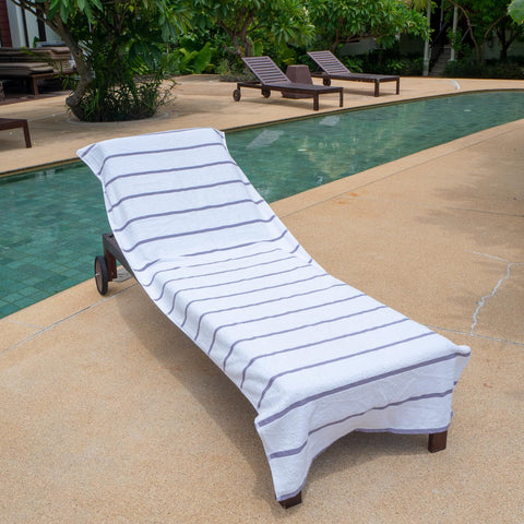 Vibrant white and grey stripes on Arkwright Las Rayas lounge cover.