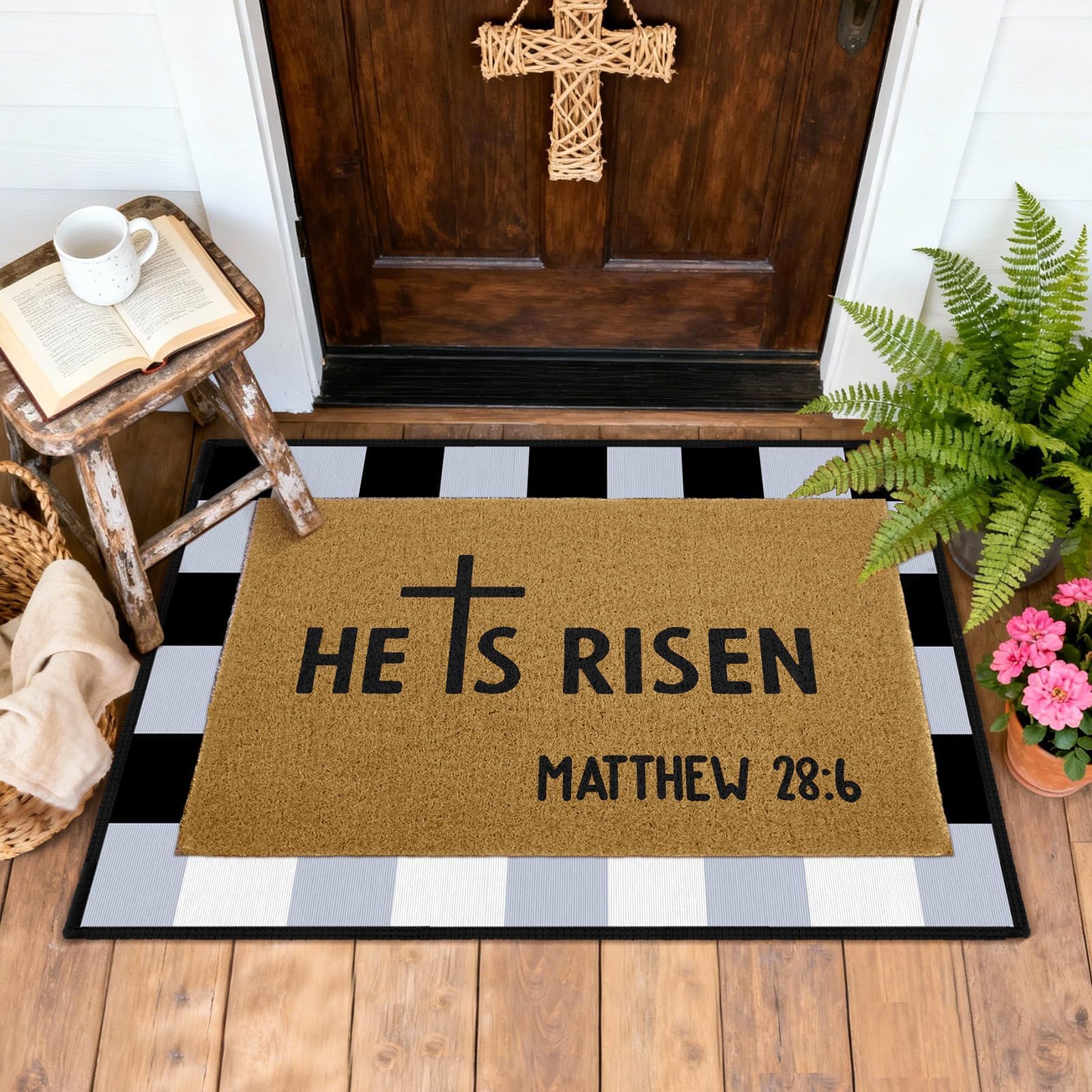 ARQRHTLY black white plaid rug layered under mat adds texture to exterior spaces