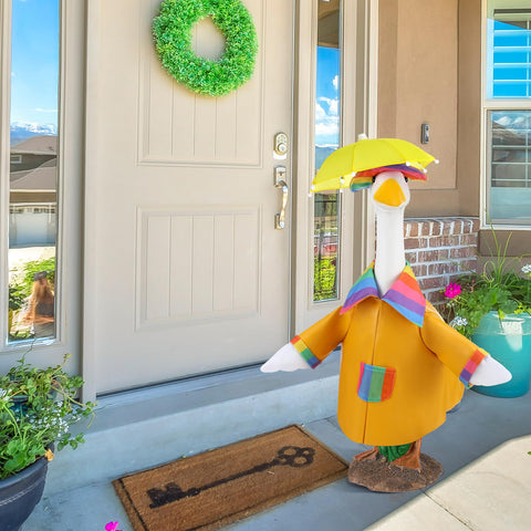 Arrowbash porch goose costume on statue showcases vibrant seasonal decoration.
