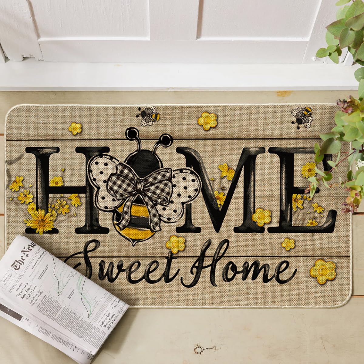 Artoid Mode Bee Daisy entryway mat provides a warm welcome for guests.