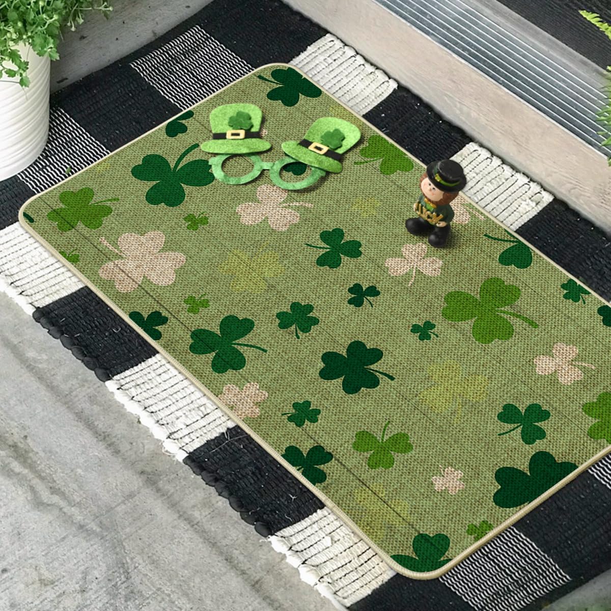 Outdoor view of Artoid Mode shamrock doormat in weather-ready setup