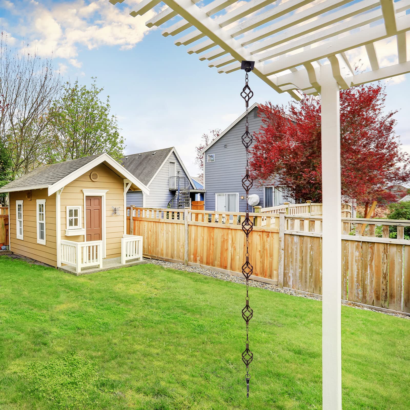 Garden decor scene featuring Aseneat rain chain along a gutter