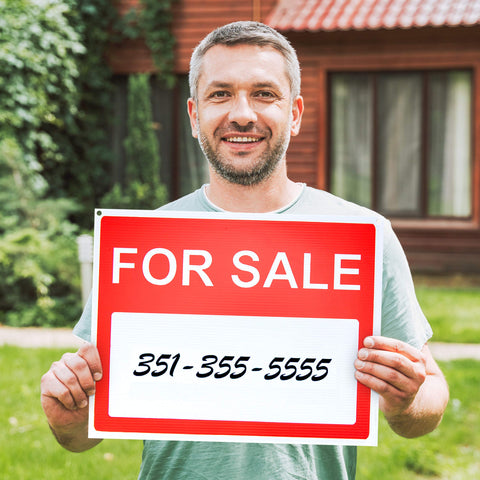 ASSURED SIGNS bright red and white design captures attention and signals a sale.