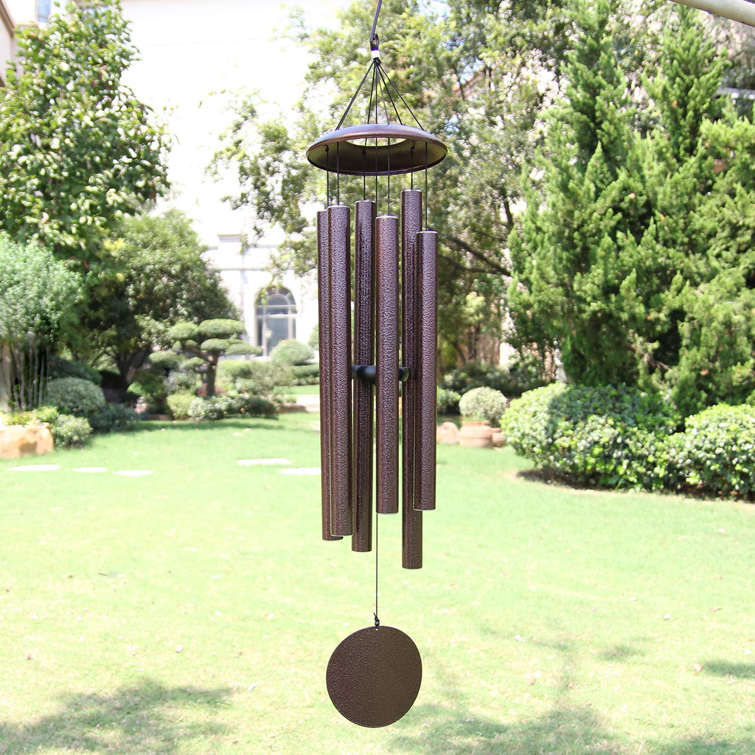 ASTARIN 45-inch wind chimes hanging in bronze finish in a garden scene