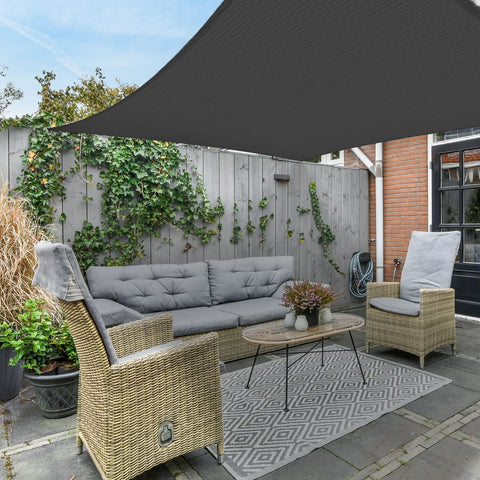 AsterOutdoor patio shade sail installed over outdoor seating.