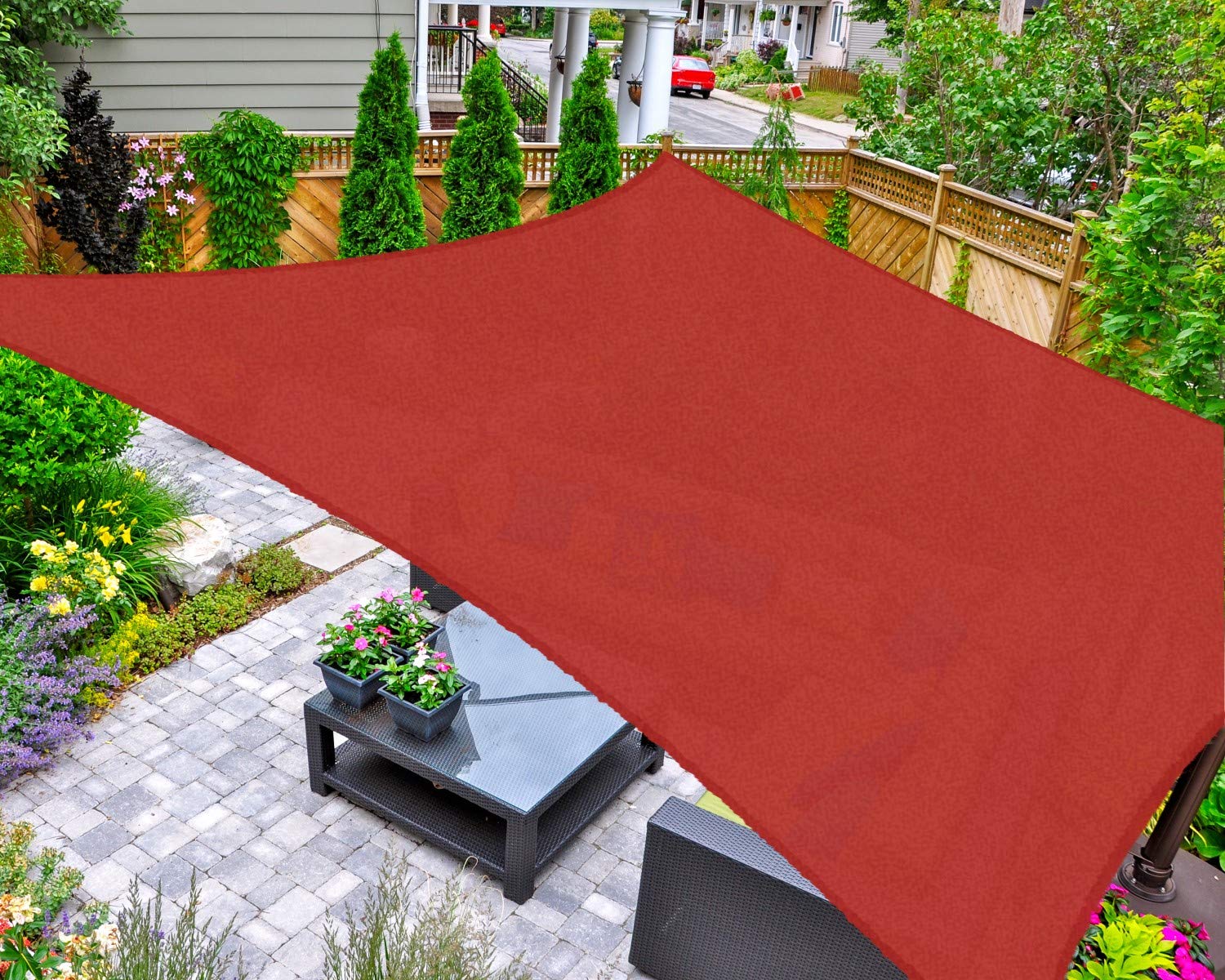 AsterOutdoor Terra sun shade sail installed over patio for shade and comfort