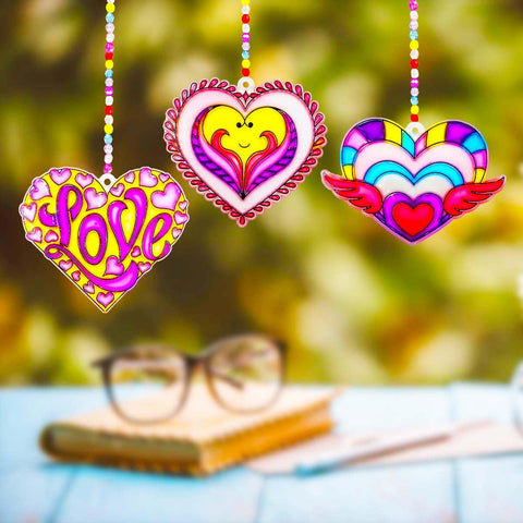 AUEKIV window display setup idea with hanging suncatchers