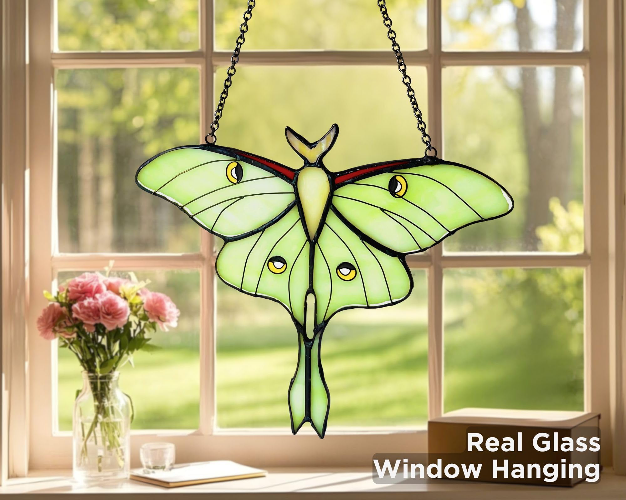 AuroAura Luna Moth stained glass captures rainbow reflections in bright light.