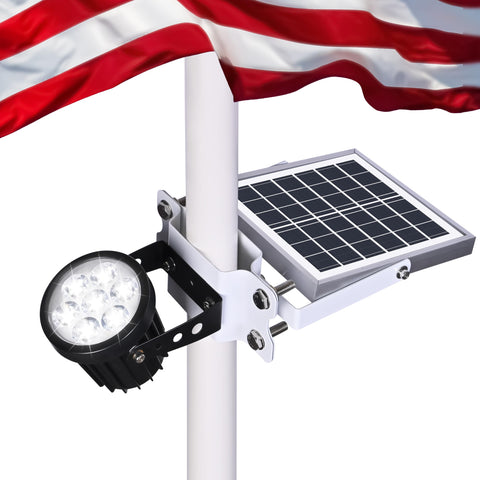 Aurolit Auro 7 flagpole light glowing at dusk for enhanced flag visibility.