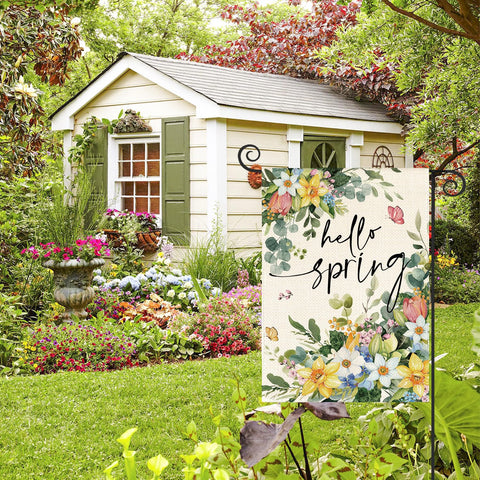 AVOIN colorlife Floral Hello Spring flag hanging on a garden pole