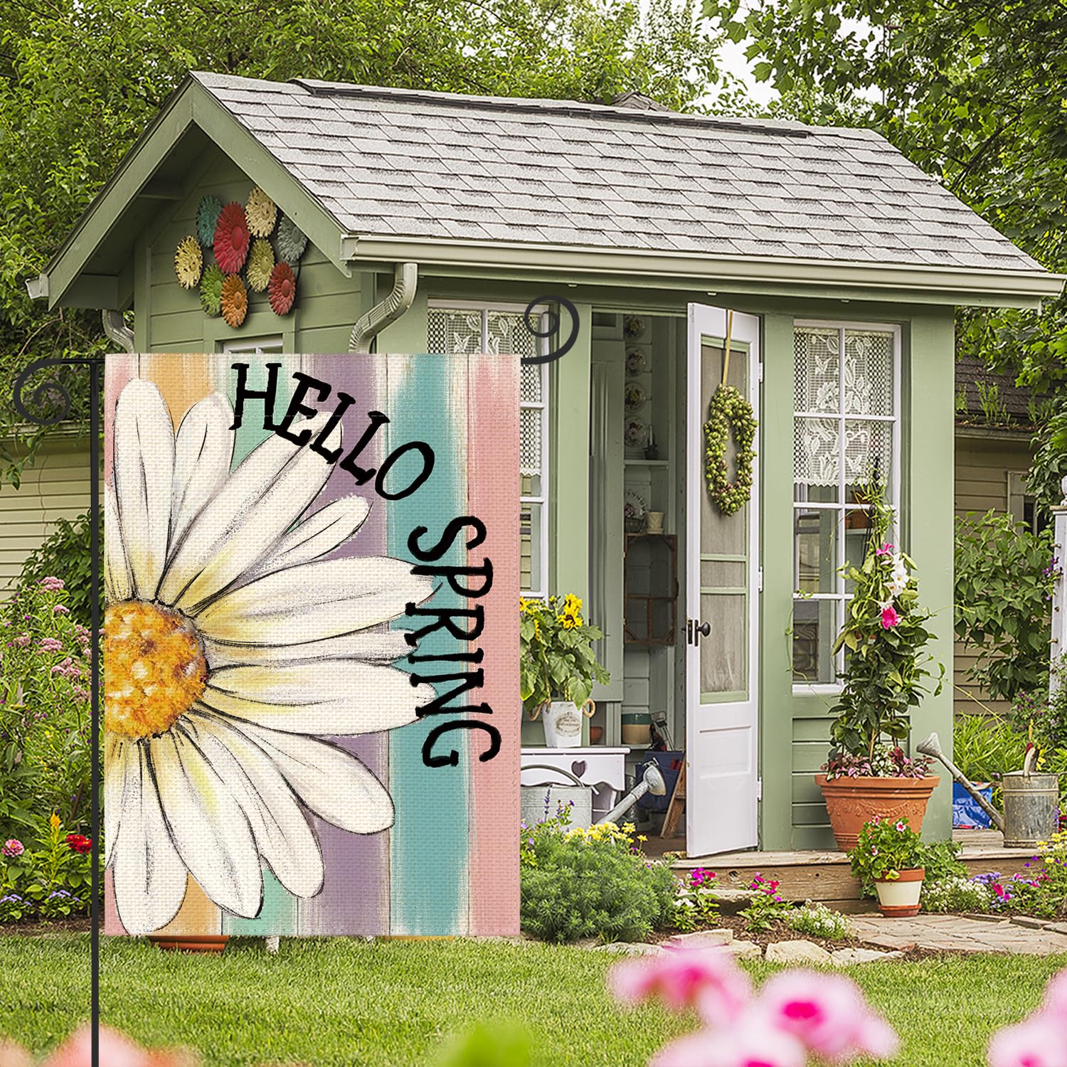 AVOIN colorlife Hello Spring flag hanging on standard garden flag stand for outdoor display.
