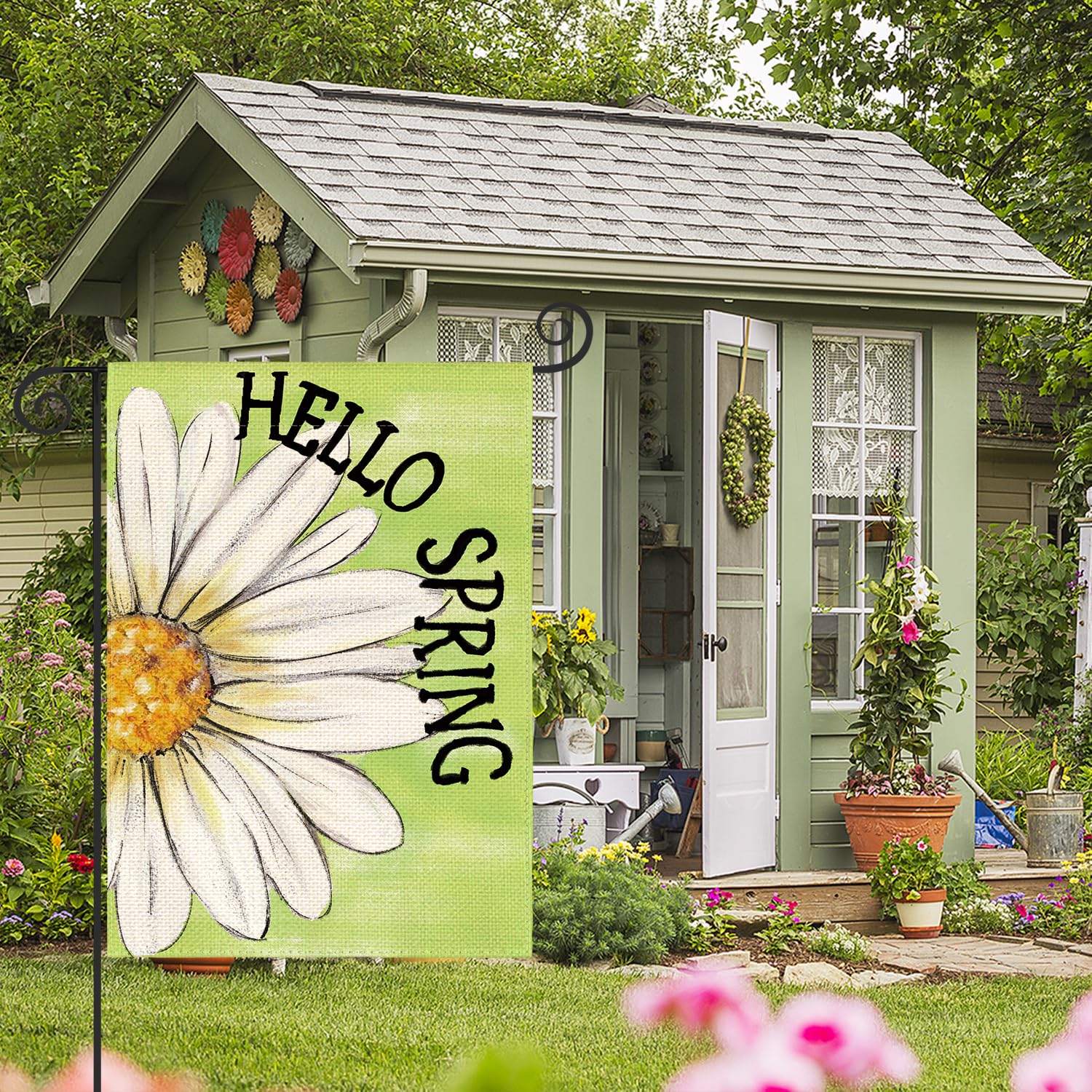 AVOIN colorlife Hello Spring Garden Flag on flagpole demonstrates easy outdoor installation.