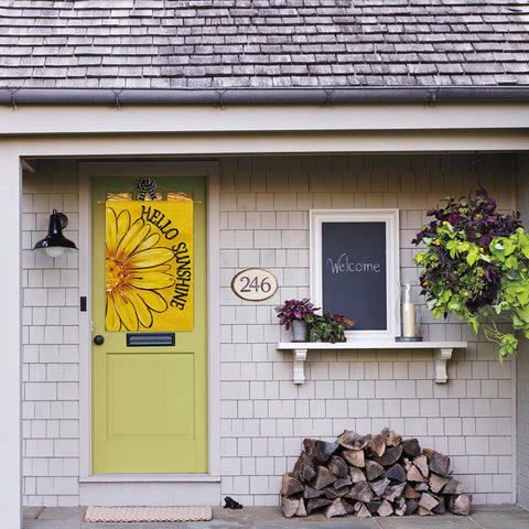 AVOIN colorlife Hello Sunshine flag outdoor display on patio adds cheerful color.
