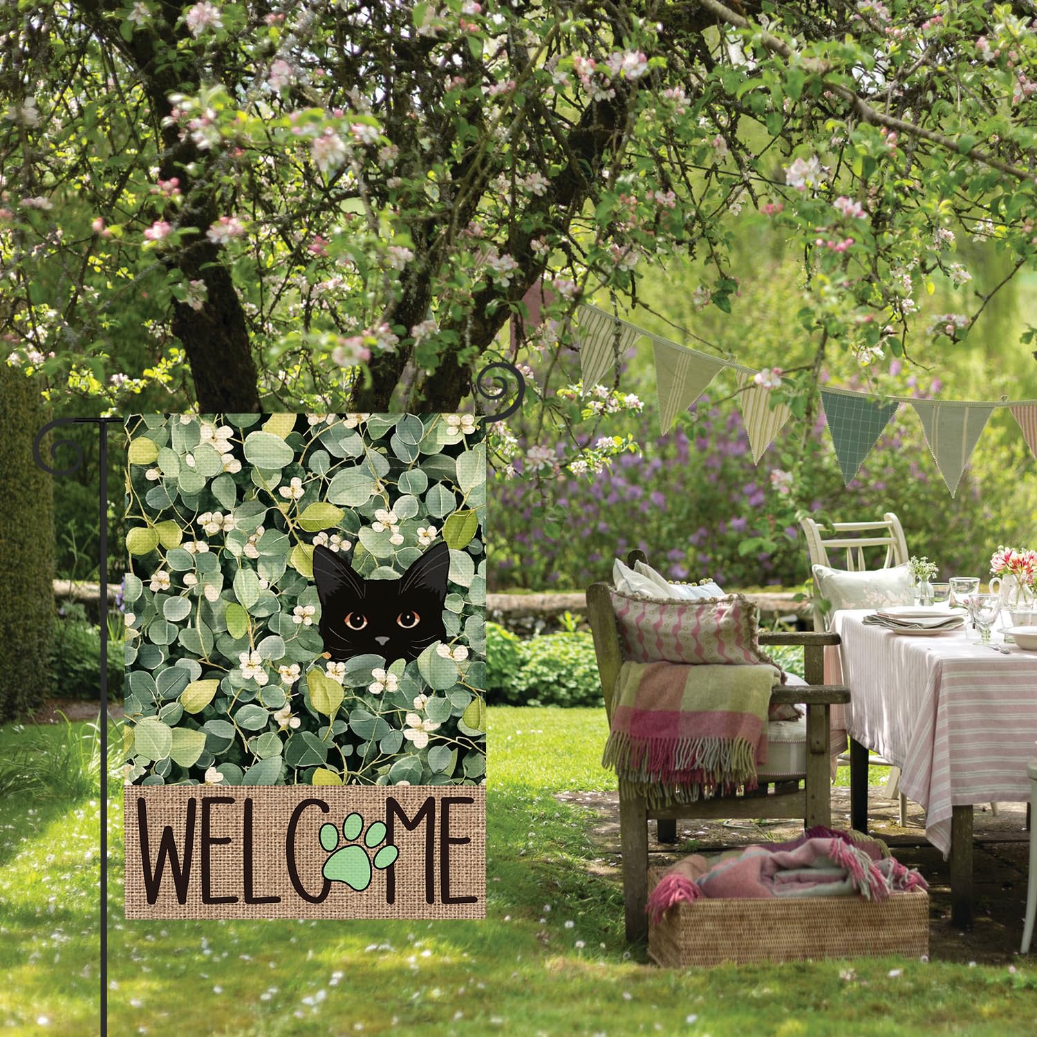 Outdoor yard flag on a garden fence enhances yard decor with florals.