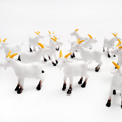 Hand-painted resin goats by Aydinids add color to succulent pots