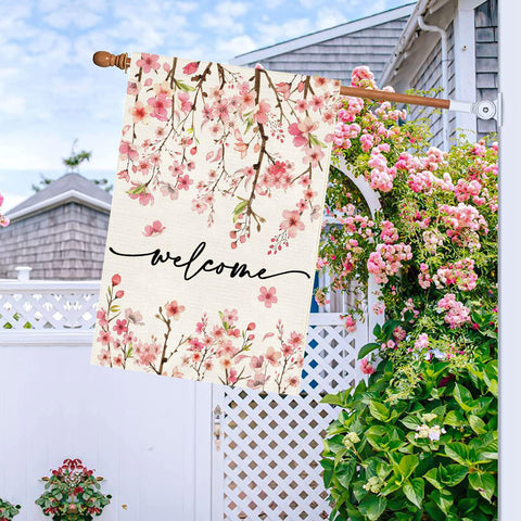 Baccessor cherry blossom yard flag features green leaves for springtime freshness.