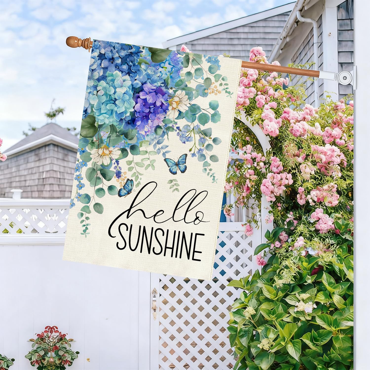 Baccessor hydrangea garden flag adds bright spring color to porch.