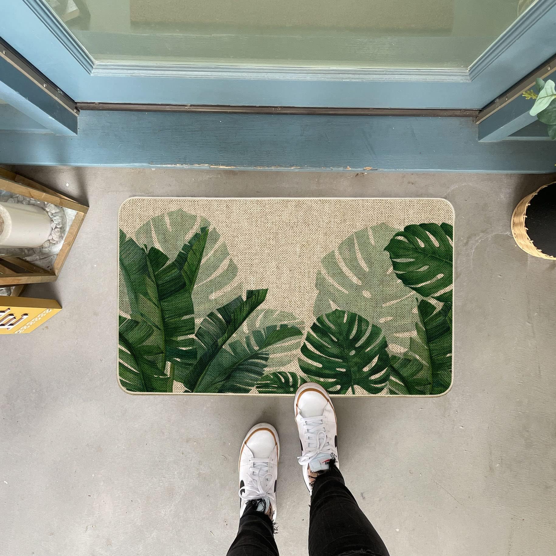 Baccessor Monstera leaf door mat at entryway enhances curb appeal and traps dirt