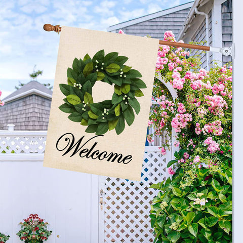 Magnolia leaves design on burlap flag, double-sided readable from both directions.