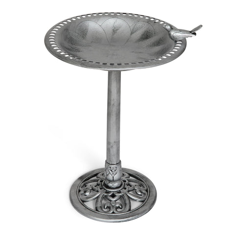Backyard Expressions birdbath with perched bird attachment highlights focal point for garden.