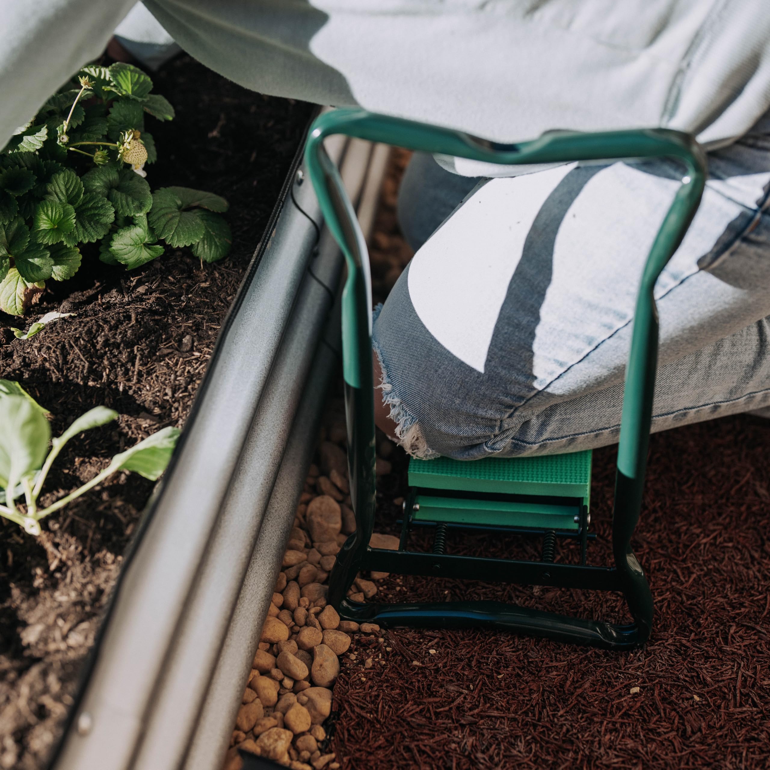 Backyard Expressions Garden Kneeler Seat in use, easing weeding with cushioned comfort.