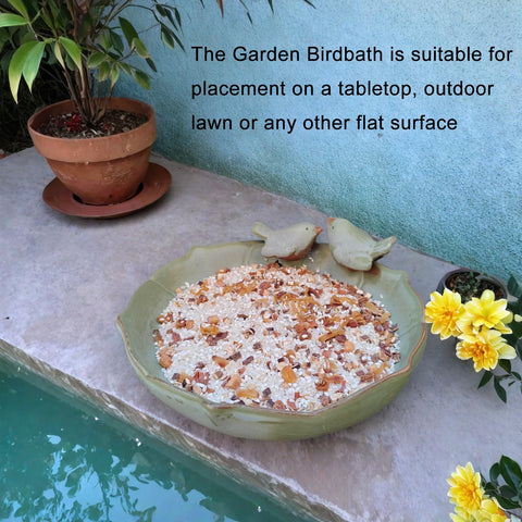 Bakayoyo green ceramic bath blends with foliage for subtle decor.