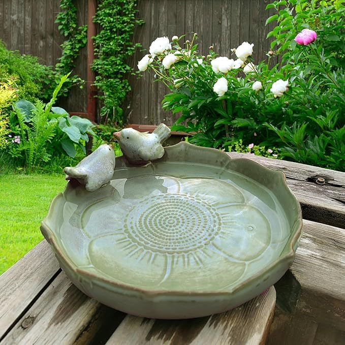 Bakayoyo ceramic bird bath with green design for outdoor hydration.