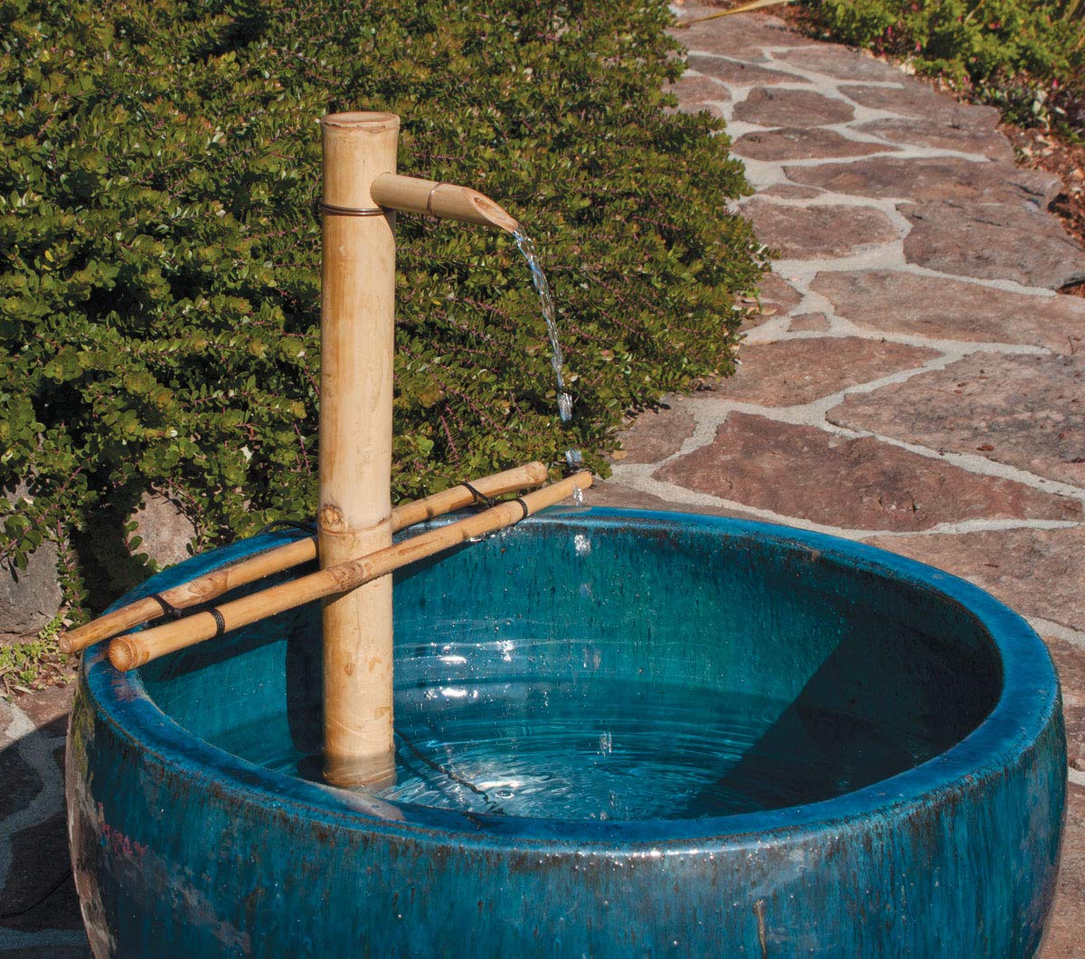 Outdoor bowl fountain installation with Bamboo Accents kit for patios.