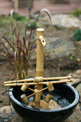 Patio zen garden water feature with Bamboo Accents for tranquil ambiance.