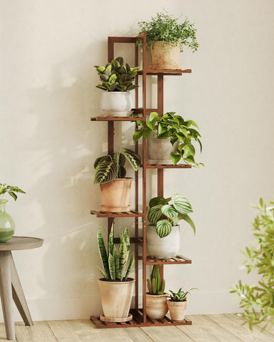 Bamworld bamboo plant stand in indoor living space, showcasing a compact, organized vertical garden.