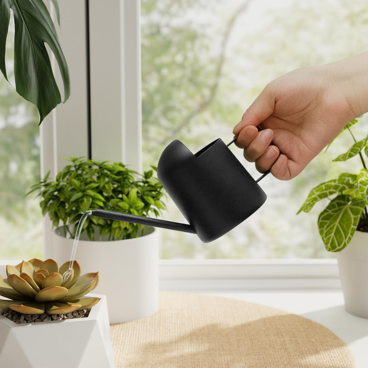 Bamworld small watering can on desk, ideal for desk plant care.