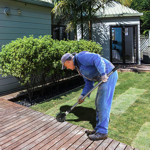 BARAYSTUS edger in use along a sidewalk delivering neat edges.