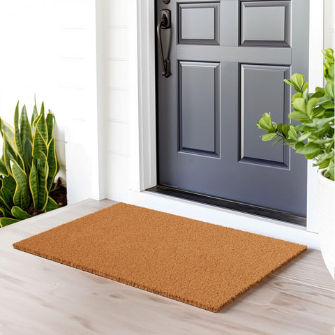 Barnyard Designs coir doormat with sturdy backing resists shifting in entryways.