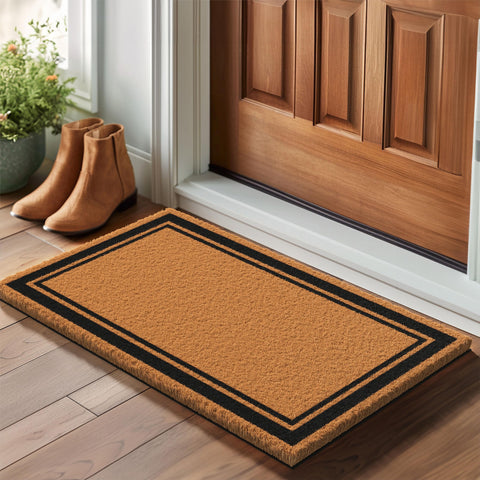 Barnyard Designs brown border doormat front door in use for welcoming guests.