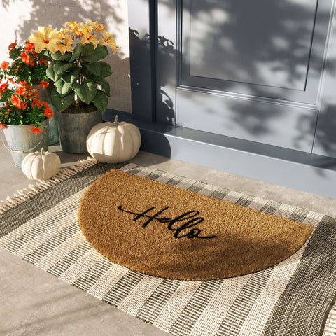 Barnyard Designs hello half-circle doormat inside entryway, adds charm and easy maintenance.