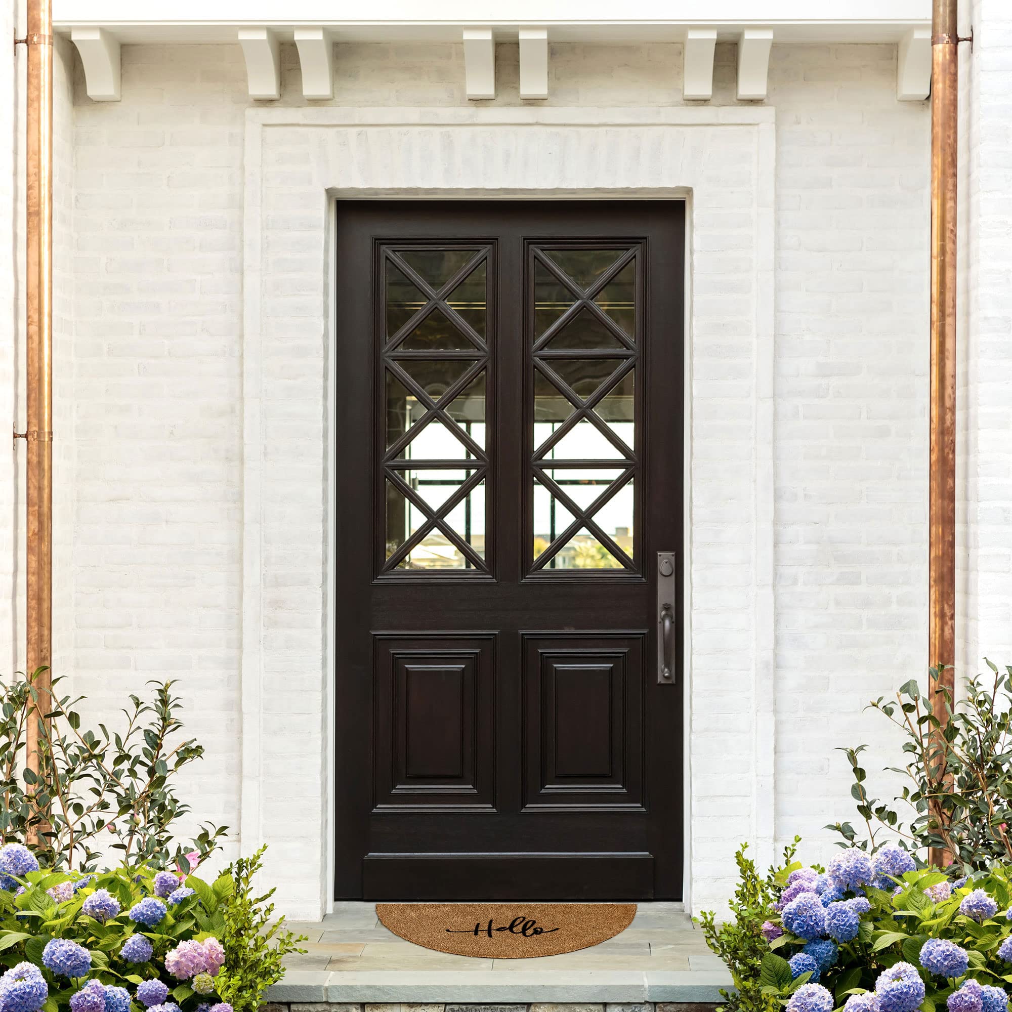 Barnyard Designs mat with non-slip backing secures position on exterior stairs.