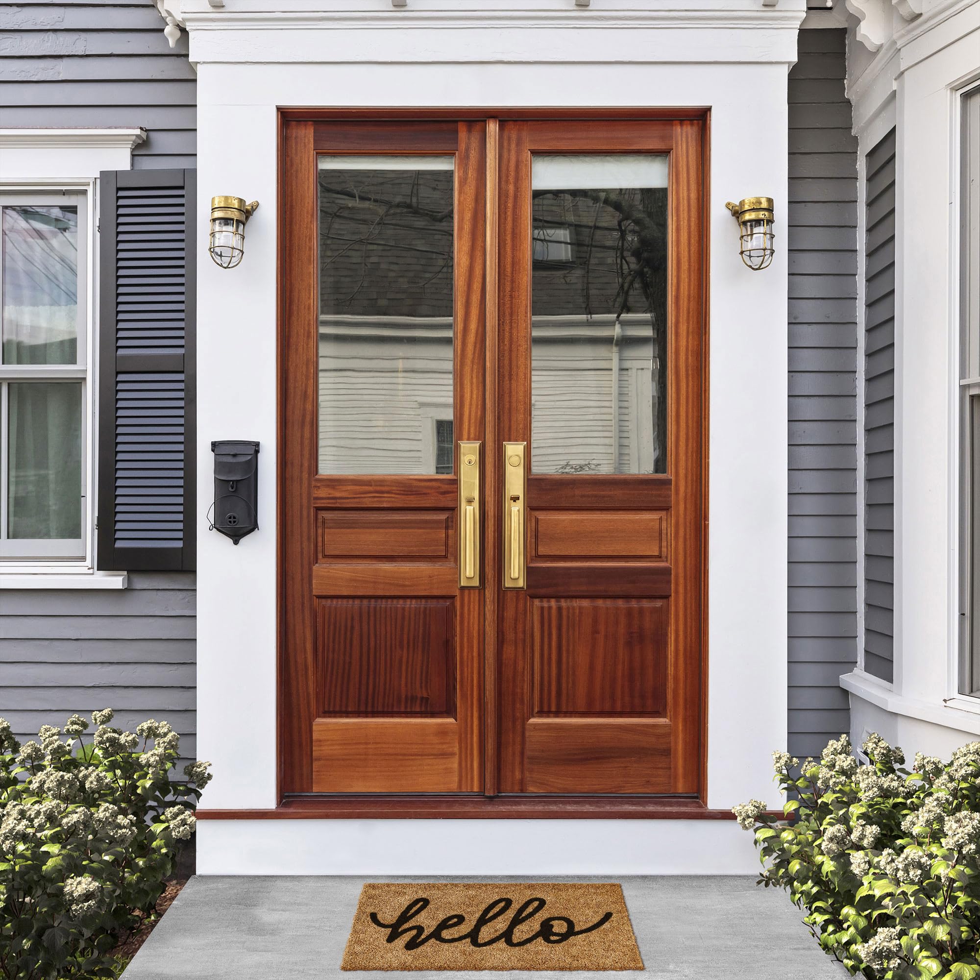 Barnyard Designs Hello doormat close-up; non-slip backing keeps entrances secure.