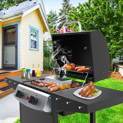 BBQCuker smoke box on grill demonstrates compatibility with charcoal setups.