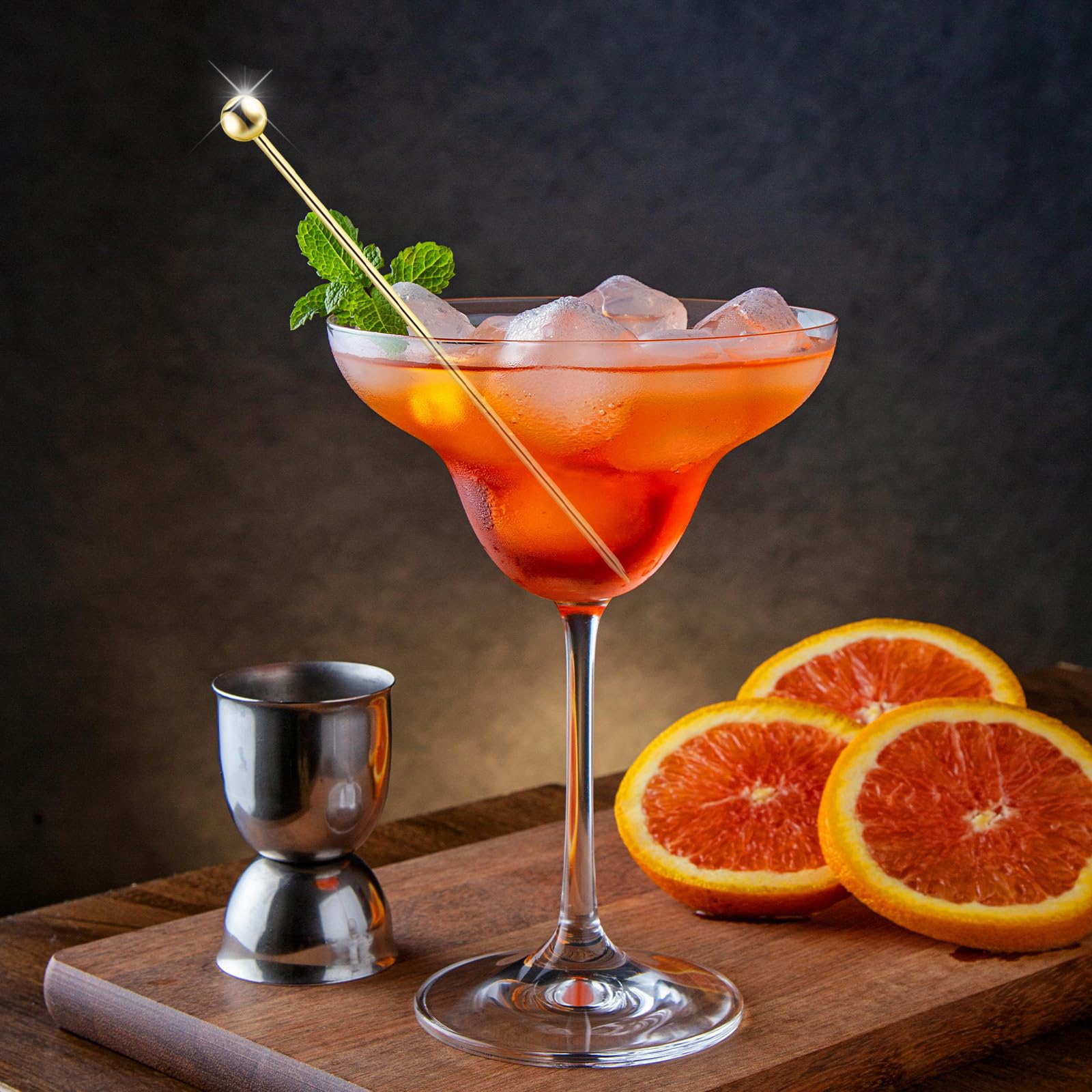 BBQStyle martini pick with olives elevates cocktail presentation.