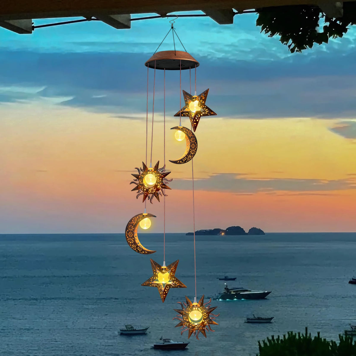 Beautyard Solar Wind Chimes illuminate with sun and moon design for garden ambiance.